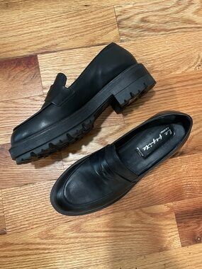 Women’s Black Leather Lug Sole Penny Loafers